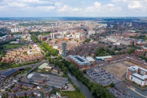 Aerial photo of the city centre of Leicester in the UK showing houses and apartment building on a sunny summers day